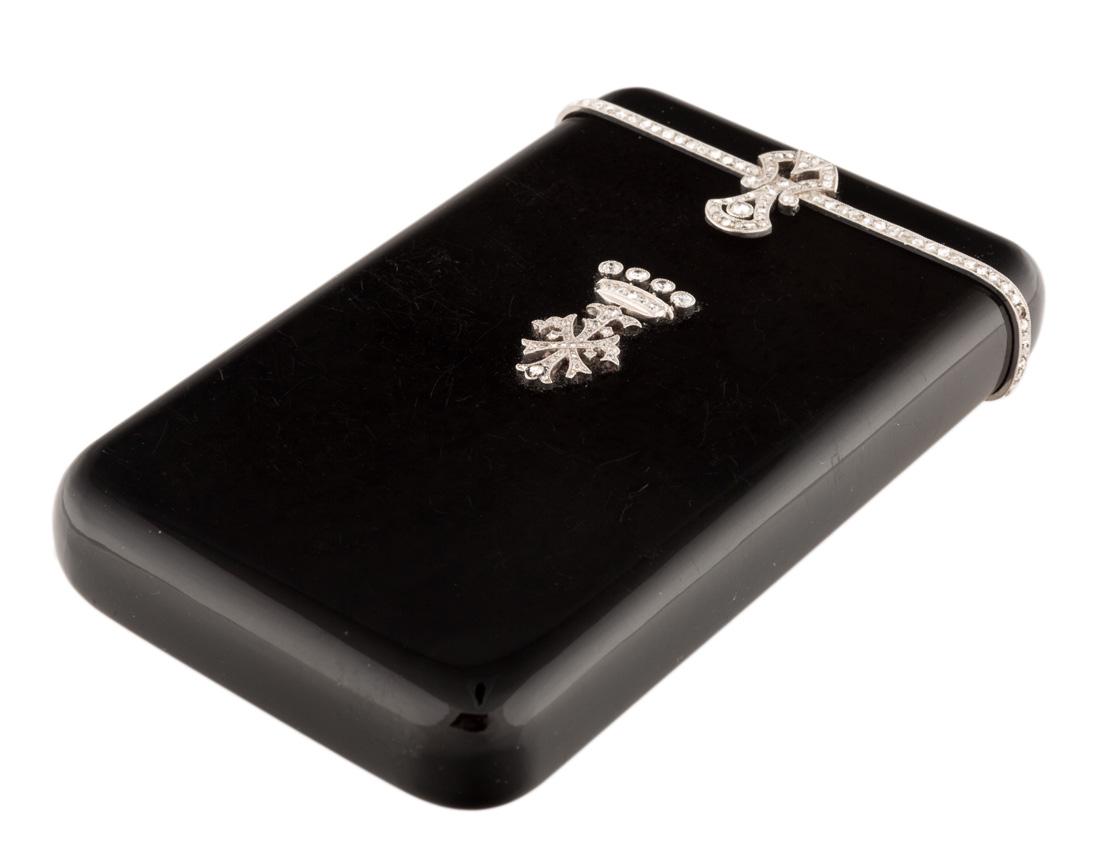 AN EARLY 20TH CENTURY ONYX AND DIAMONDS CIGARETTE CASE (1 of 4)