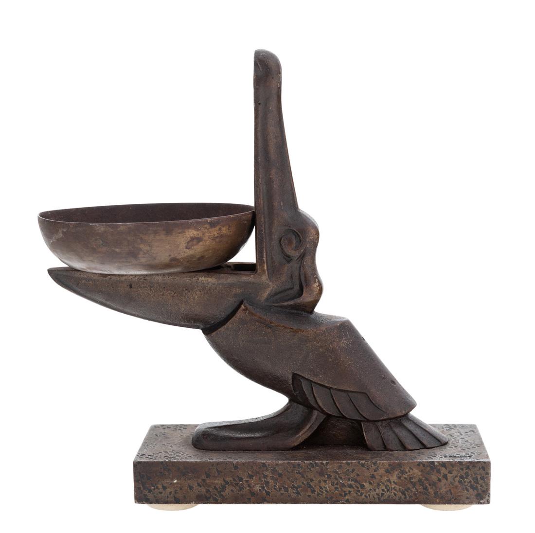 AN ART DECO VIDE-POCHE BY EDGAR BRANDT (FRENCH: AN ART DECO VIDE-POCHE BY EDGAR BRANDT (FRENCH 1880-1960) Pelican, bronze with medium brown patina overall height: 14.5 cm (5 3/4 in.) signed on base PROVENANCE Hotel de Ventes de Neuilly, Neuilly-sur
