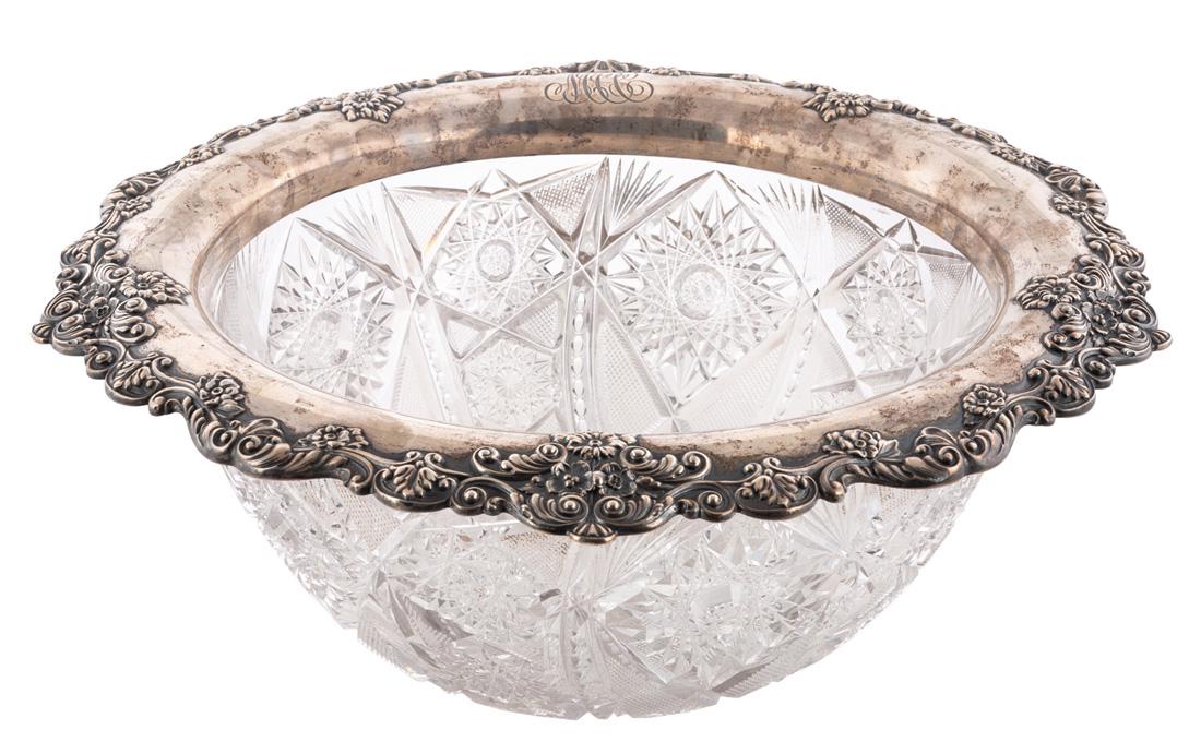 A SILVER-MOUNTED CUT CRYSTAL CENTERPIECE, LATE 19TH: A SILVER-MOUNTED CUT CRYSTAL CENTERPIECE, LATE 19TH CENTURY cut in star pattern, the silver-mounted rim with scalloped edges with scrolling floral and palmette motifs, monogrammed MCC, diameter: 41 cm