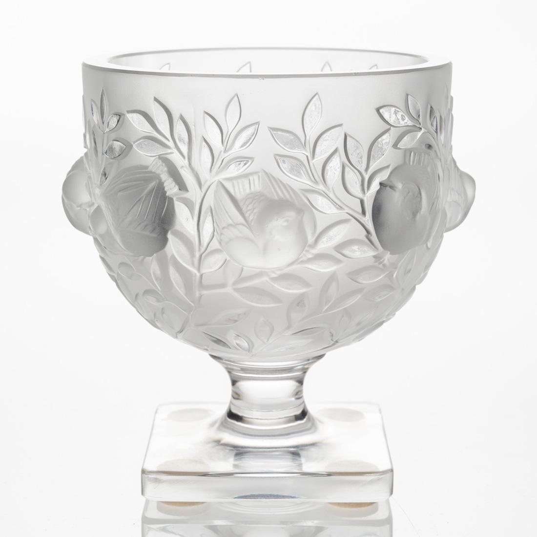 A LALIQUE 'MOINEAUX' VASE, CIRCA 1950S: A LALIQUE 'MOINEAUX' VASE, CIRCA 1950S of squat round form in molded frosted glass, featuring sparrows and foliage throughout, the foot with square base, signed Lalique / France under base; overall he