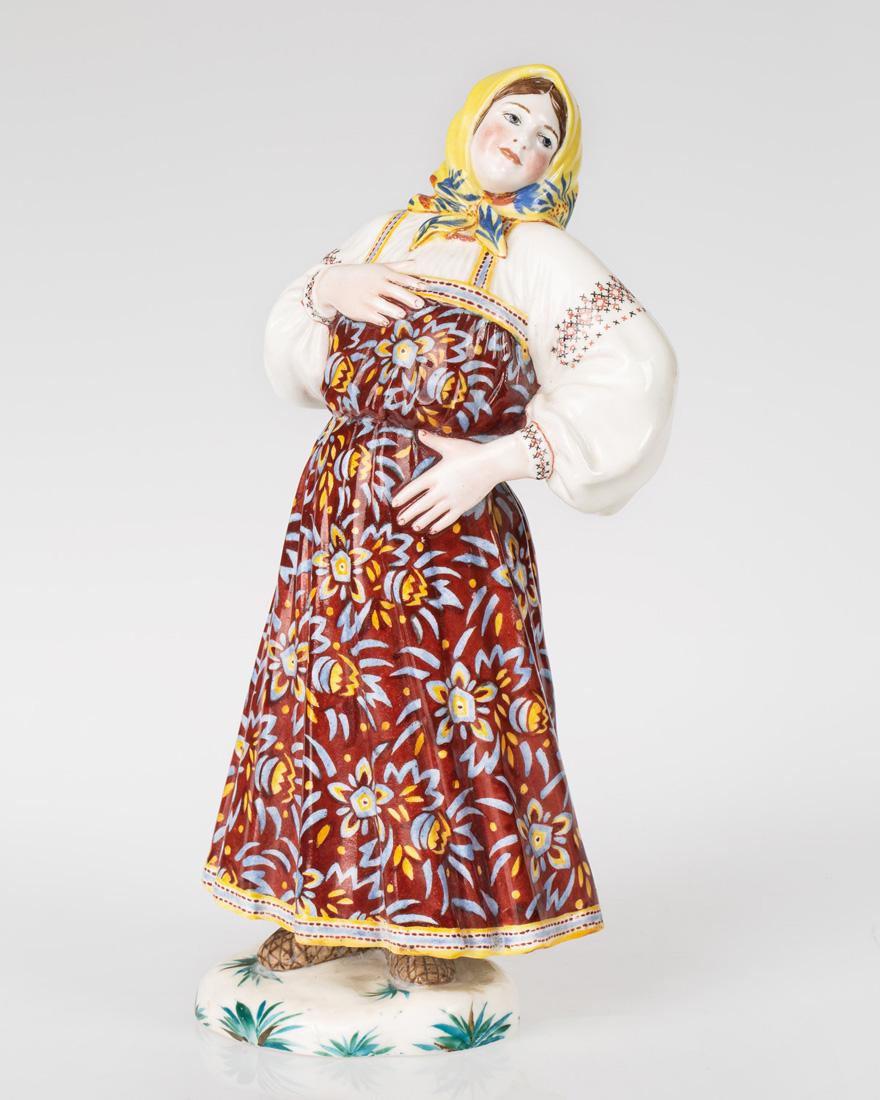 A SOVIET PORCELAIN FIGURE OF A DANCER AFTER NATALYA: A SOVIET PORCELAIN FIGURE OF A DANCER AFTER NATALYA DANKO (RUSSIAN 1892-1942) BY EKATERINA YAKIMOVSKAYA (RUSSIAN 1895-197?), STATE PORCELAIN FACTORY, 1923 depicting a peasant woman in a yellow headsca