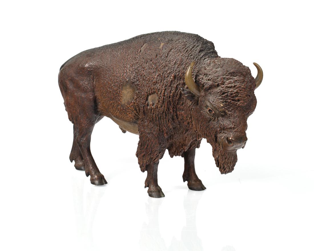 AN AUSTRIAN COLD-PAINTED BRONZE MODEL OF A BUFFALO,: AN AUSTRIAN COLD-PAINTED BRONZE MODEL OF A BUFFALO, FRANZ BERGMAN, VIENNA, CIRCA 1900 depicting a standing buffalo, marked with GESCHUTZT, numeral 4867 and Bergman foundry mark underneath; height: 19 