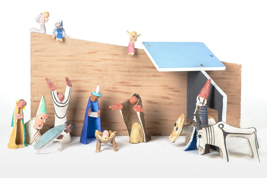 JEAN LAMBERT-RUCKI (POLISH 1888-1967): JEAN LAMBERT-RUCKI (POLISH 1888-1967) The Nativity, painted ceramic with painted plywood stable set comprising: a) the infant Christ laying in a straw-covered cradle; overall dimensions: 5.5 (h