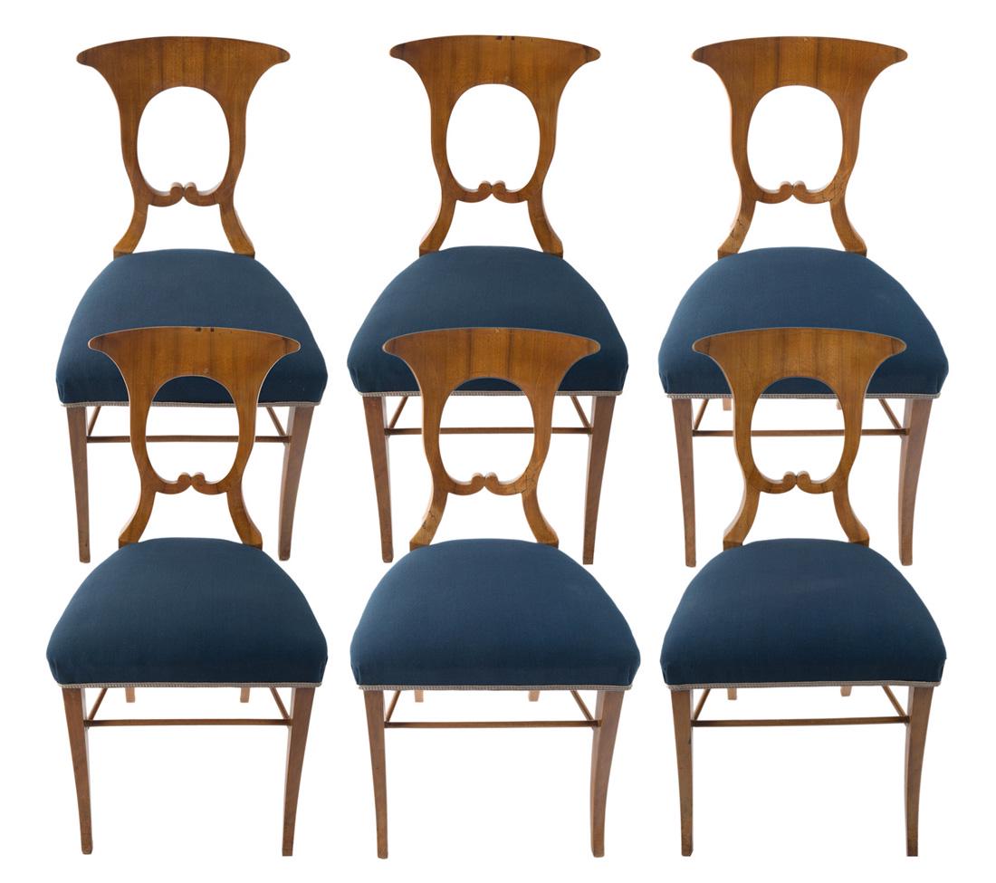 A SET OF SIX BIEDERMEIER WALNUT SIDE CHAIRS, SECOND: A SET OF SIX BIEDERMEIER WALNUT SIDE CHAIRS, SECOND QUARTER OF 19TH CENTURY each with an arched cresting and pelta-shaped back, with blue upholstery, supported by four sabre legs; overall dimensions o