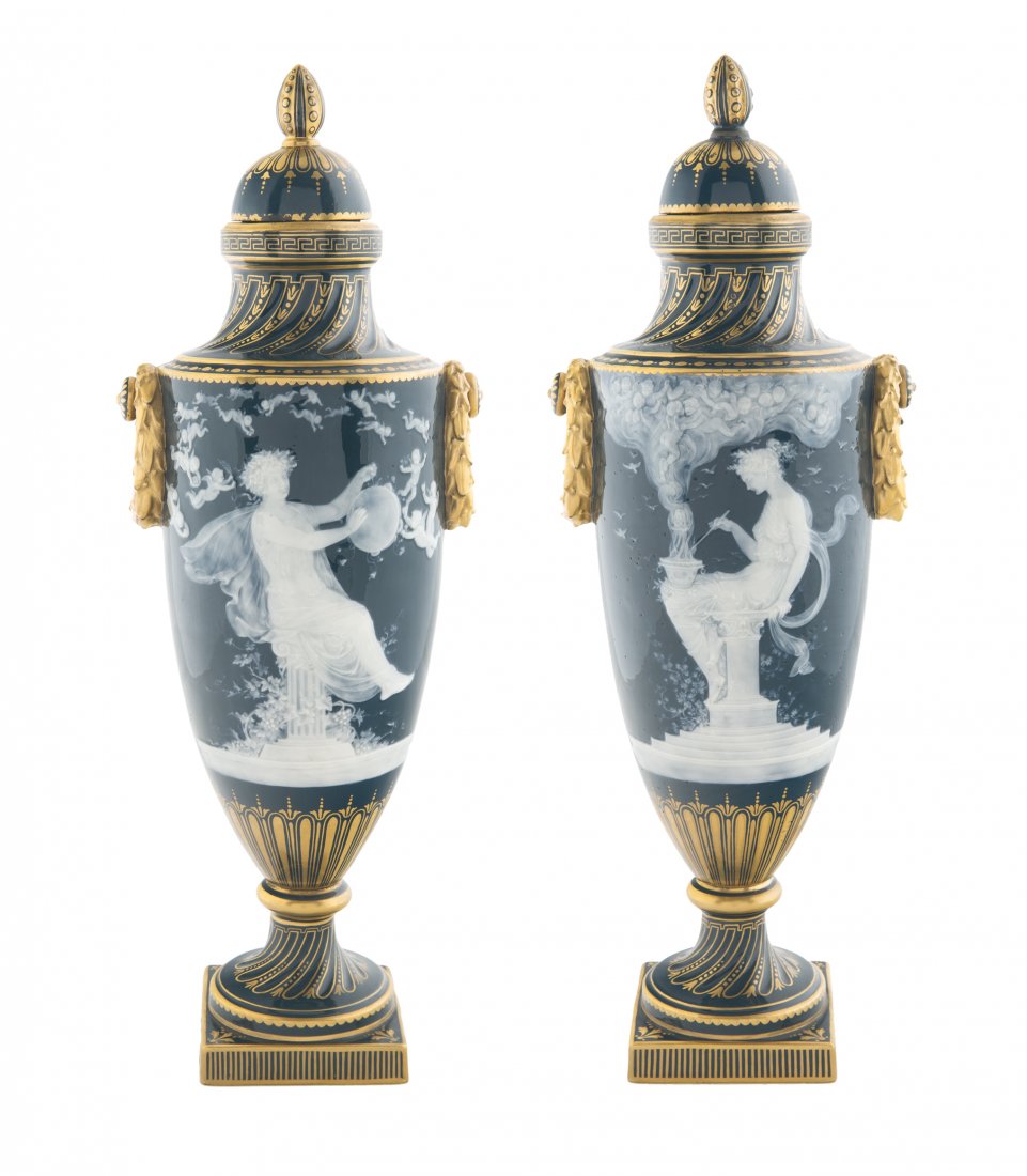A PAIR OF ENGLISH PATE-SUR-PATE VASES, MINTONS,: A PAIR OF ENGLISH PATE-SUR-PATE VASES, MINTONS, STOKE-UPON-TRENT, 1919 oviform, the seafoam-green hard-paste bodies with handles formed as wreaths, with domed covers terminating in pinecone finials, g