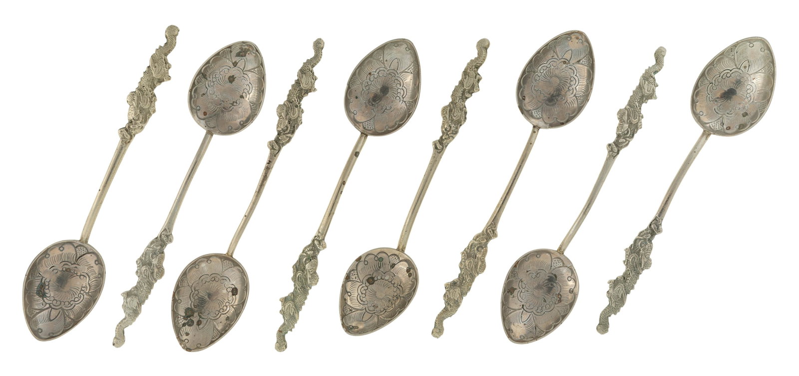 SET OF EIGHT JAPANESE SILVER SPOONS Nagasaki stamp: SET OF EIGHT JAPANESE SILVER SPOONS Nagasaki stamp on back of spoon head, floral design on the front of spoon head, dragon design on base of handle; Height 13.1 cm (5.15 in)