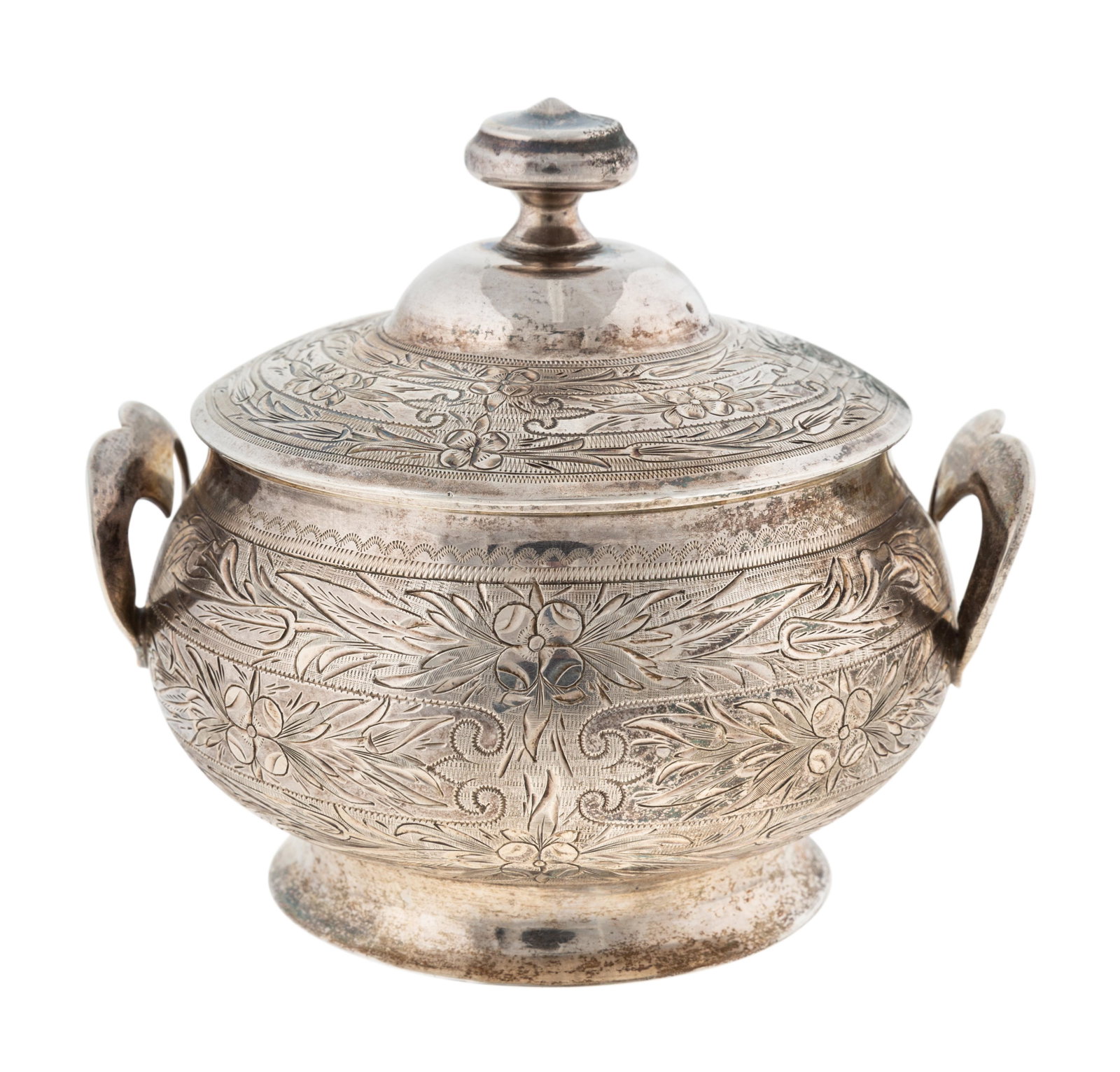 RUSSIAN GILT SILVER BOX A Russian gilt silver box in: RUSSIAN GILT SILVER BOX A Russian gilt silver box in circular form with an all-encompasing floral design and two heart-shaped handles