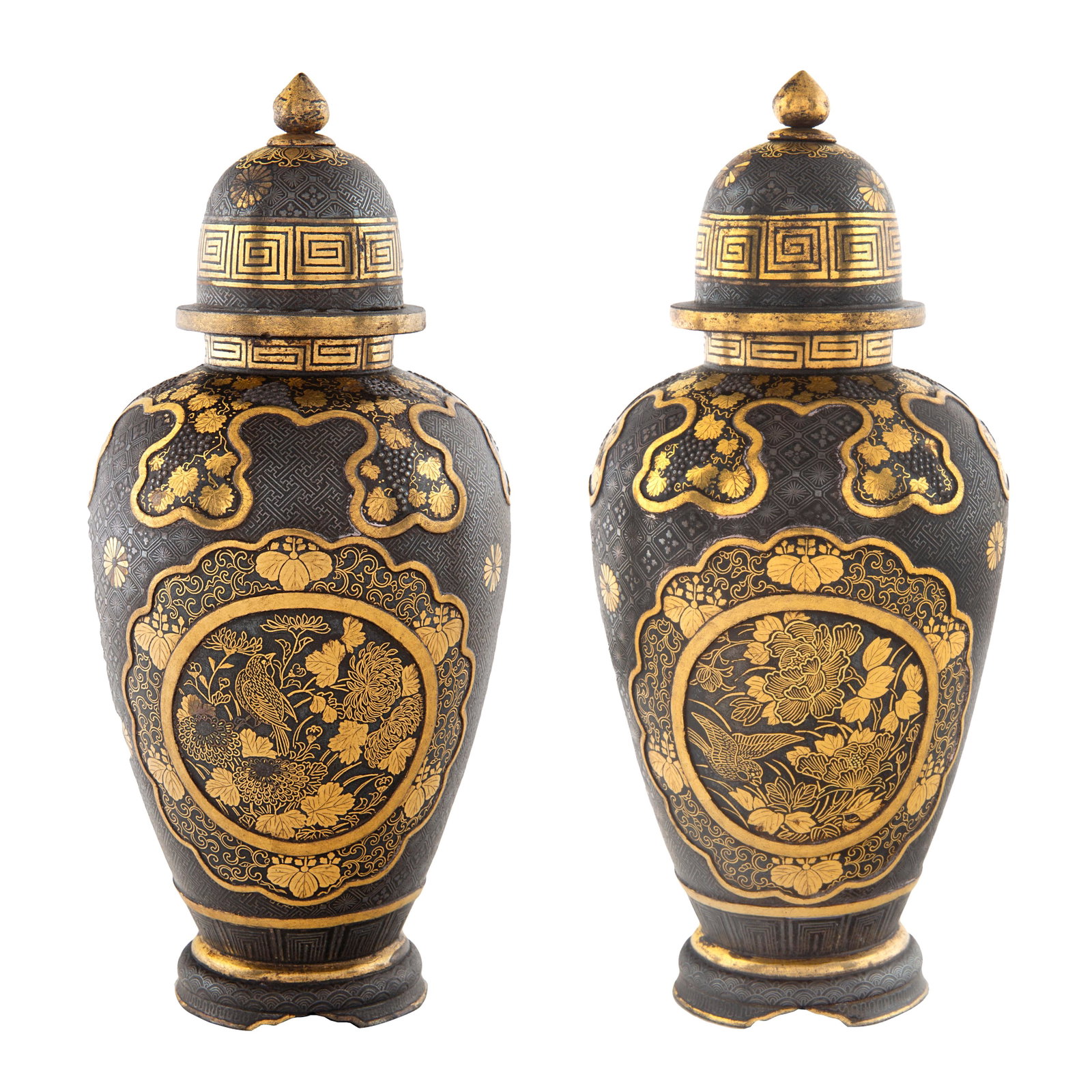 A PAIR OF COVERED JAPANESE MINIATURE URNS, MEIJI PERIOD: A PAIR OF COVERED JAPANESE MINIATURE URNS, MEIJI PERIOD (1868-1912) each of baluster form, each featuring a landscape with house (recto) and a bird and flower (verso) cartouche, against a reticulated 