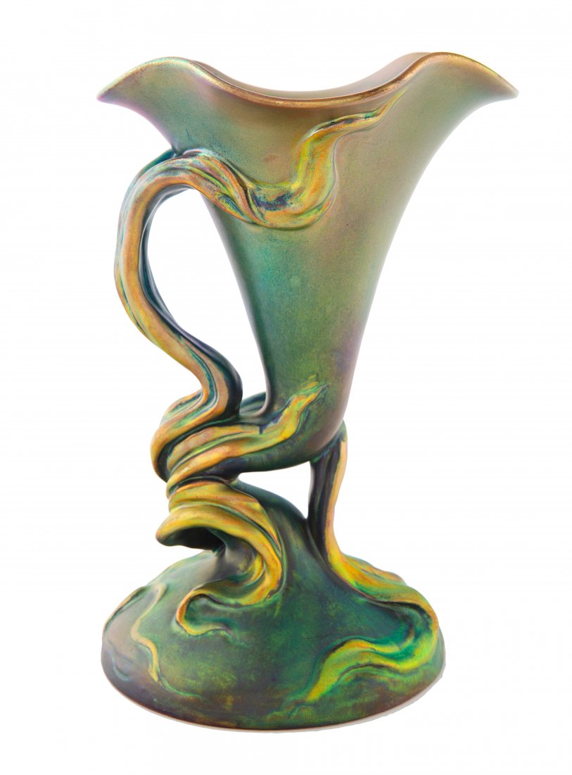 A HUNGARIAN EOSIN-GLAZED HANDLED: A HUNGARIAN EOSIN-GLAZED HANDLED 'VINE' VESSEL, ZSOLNAY PORCELAIN FACTORY, PECS, CIRCA 1900 the handle formed as a ribbon vine supporting the horn-like body, the lip with undulating edges, the base ci