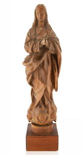 A CARVED WOODEN FIGURE OF THE IMMACULATE VIRGIN, MOST: A CARVED WOODEN FIGURE OF THE IMMACULATE VIRGIN, MOST LIKELY GRANADA, SPANISH 17TH CENTURY shown standing, with her hands clasped in prayer, she stands atop heads of angels, draped in a layered