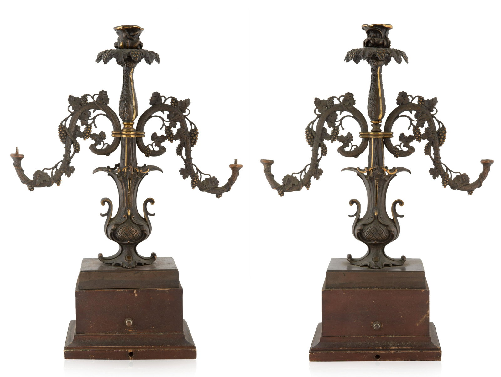 A PAIR OF BRONZE CANDELABRAS, LATE 19TH CENTURY: A PAIR OF BRONZE CANDELABRAS, LATE 19TH CENTURY three light candelabras, the arms formed from a continuous grapevine, the center light and body terminating from leaves, all atop a square plinth; overa