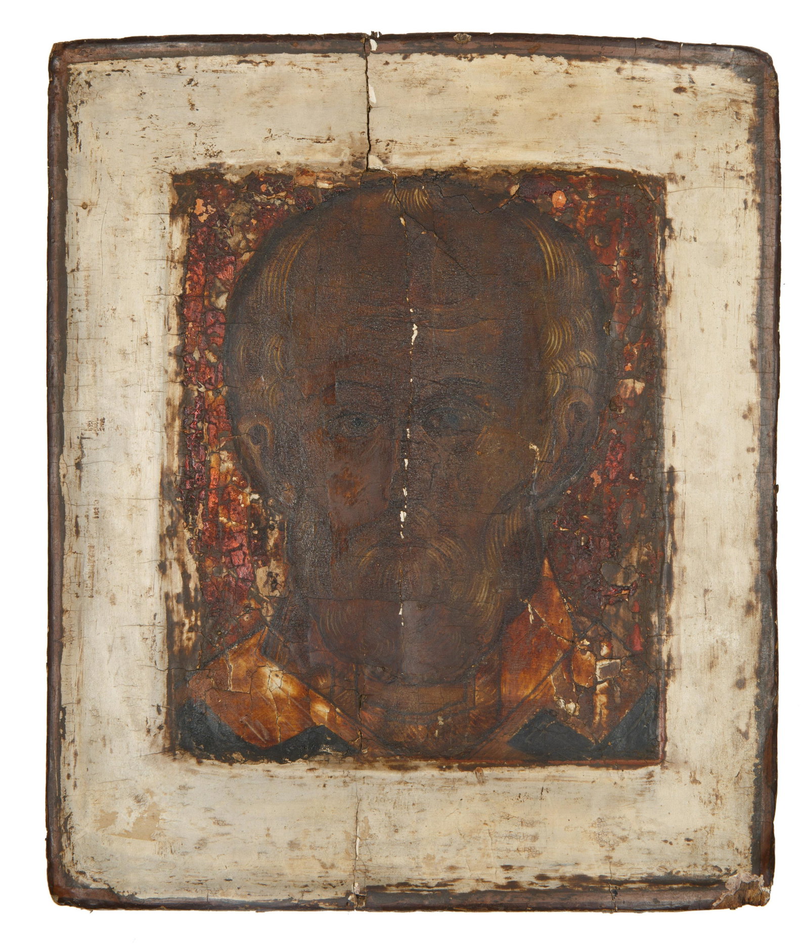 17TH CENTURY ST. NICHOLAS THE WONDERWORKER ICON: 17TH CENTURY ST. NICHOLAS THE WONDERWORKER ICON depicting a bust-length St. Nicholas the Wonderworker wearing a bishop's omophorion, egg tempera and gesso on wood panel; dimensions of icon: 31 x 25.7 