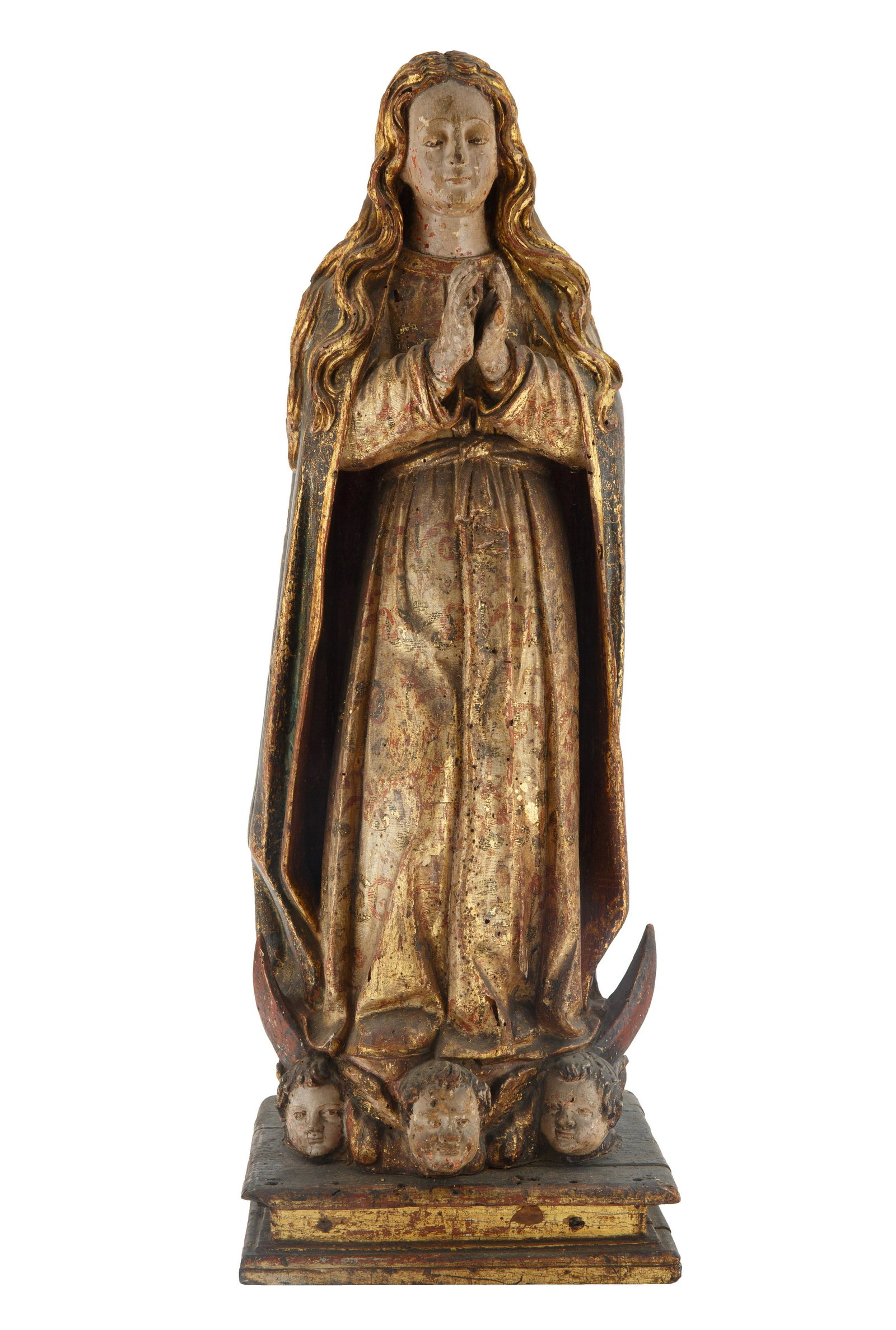 18TH CENTURY LATIN AMERICAN POLYCHROME VIRGIN: 18TH CENTURY LATIN AMERICAN POLYCHROME VIRGIN shown standing in resplendent cisele robes on a crescent moon with the heads of three seraphs, following the iconography of the Woman of the Apocalypse in