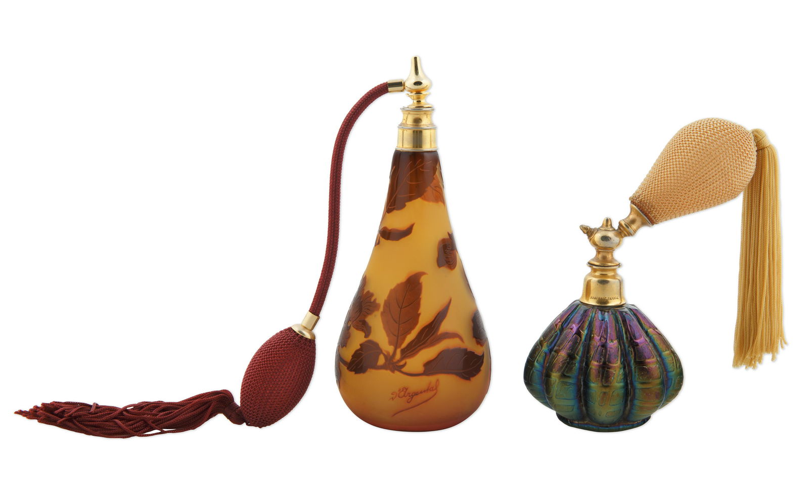 PAIR OF GLASS ATOMIZER PERFUME BOTTLES: PAIR OF GLASS ATOMIZER PERFUME BOTTLES comprising: a) D'ARGENTAL CAMEO GLASS ATOMIZER, of amphora form, the body with a continuous motif of dark maroon rhododendron against a colorless ground, with a