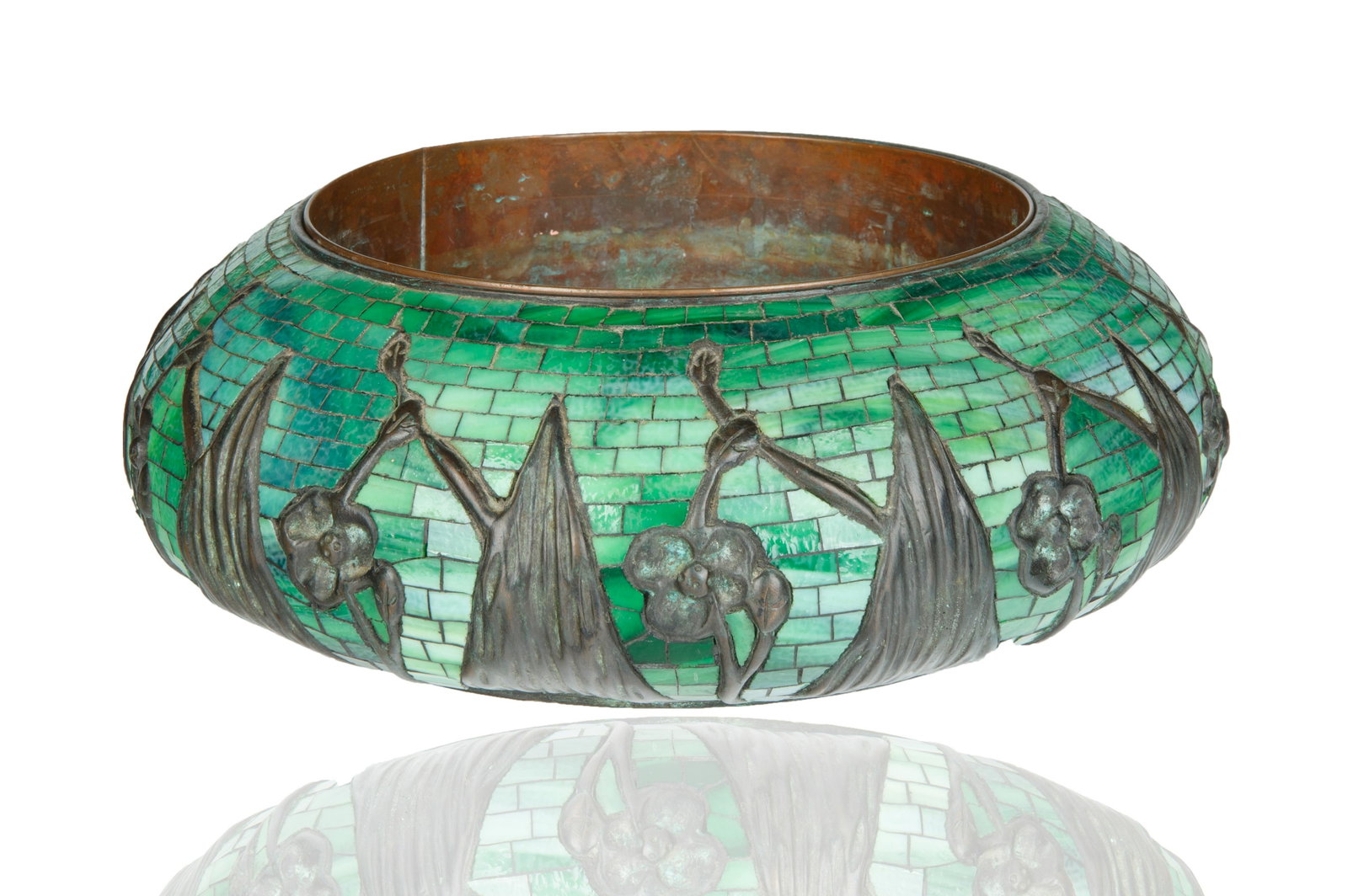 JARDINIERE AFTER TIFFANY STUDIOS: squat balbous form, the body with different hues of green glass with patinated bronze with original metal liner, stamped TIFFANY STUDIOS NEW YORK with numerals 238 underside; diameter: 19 cm (7 1/2 in