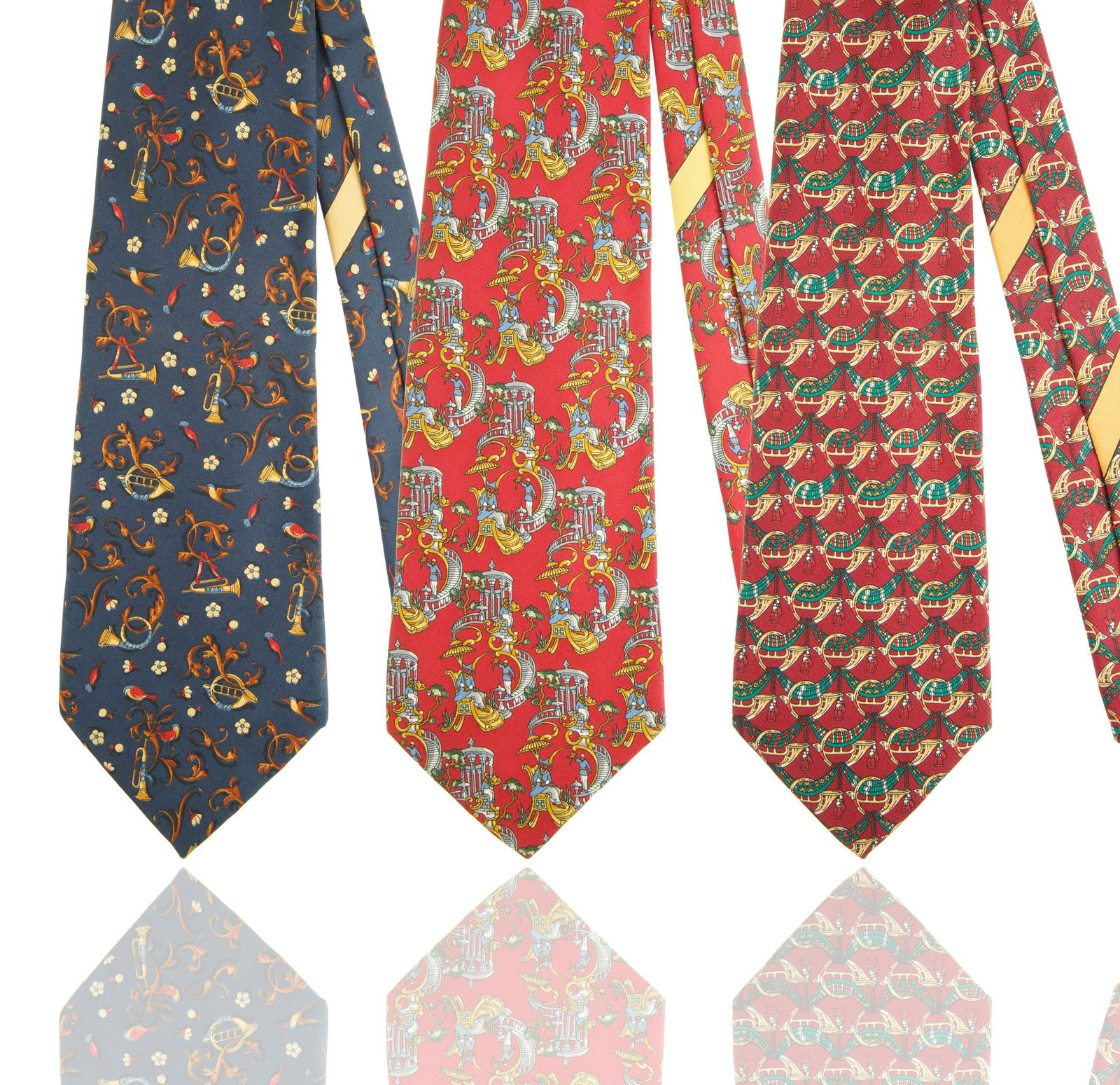 GROUP OF THREE FERRAGAMO TIES: the group with both iconic and traditional designs, each crafted from silk, each with Ferragamo label and some with House emblem with copyright on back; length: 74.5 cm (29 3/8 in.), width: 9 cm (3 1/