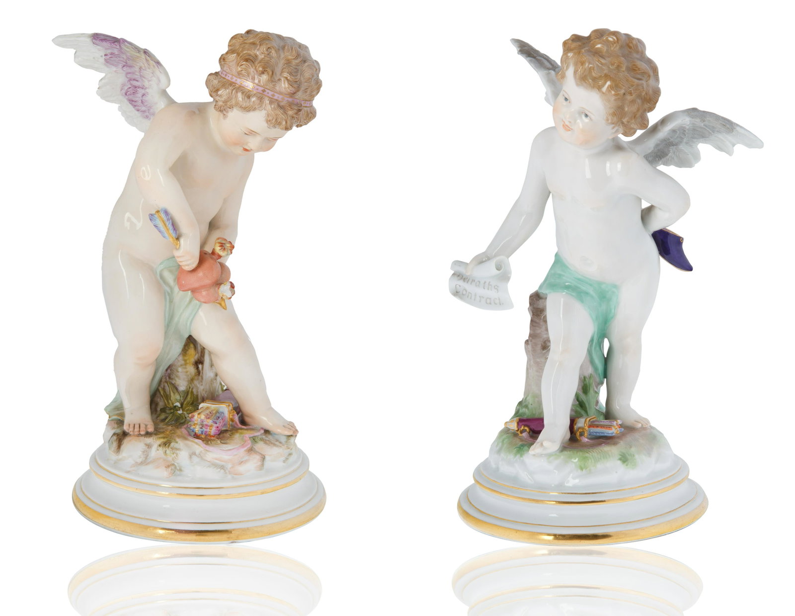 A MEISSEN 'CUPID' PORCELAIN FIGURE: both modelled after Henrich Schwabe and Johann Pollak (1880-1882), part of the Four Cupids Series, comprising a) Cupid with Marriage Contract, the putti nude standing with quiver at his feet, on a rou