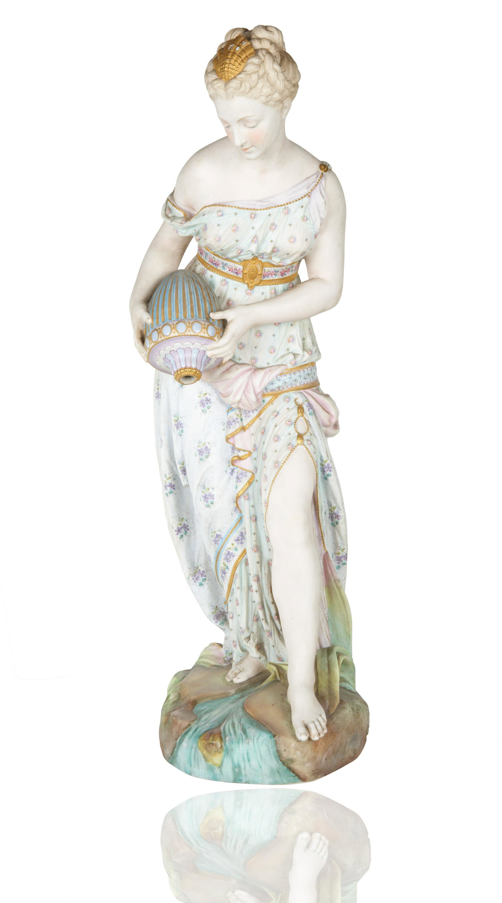FRENCH BISQUE PORCELAIN NEOCLASSICAL BEAUTY: modelled upright atop a naturalistic base of grass and flowing water, dressed in a pastel neoclassical dress with baring one shoulder, she holds a pastel and gilt water jug, glancing softly downward, 