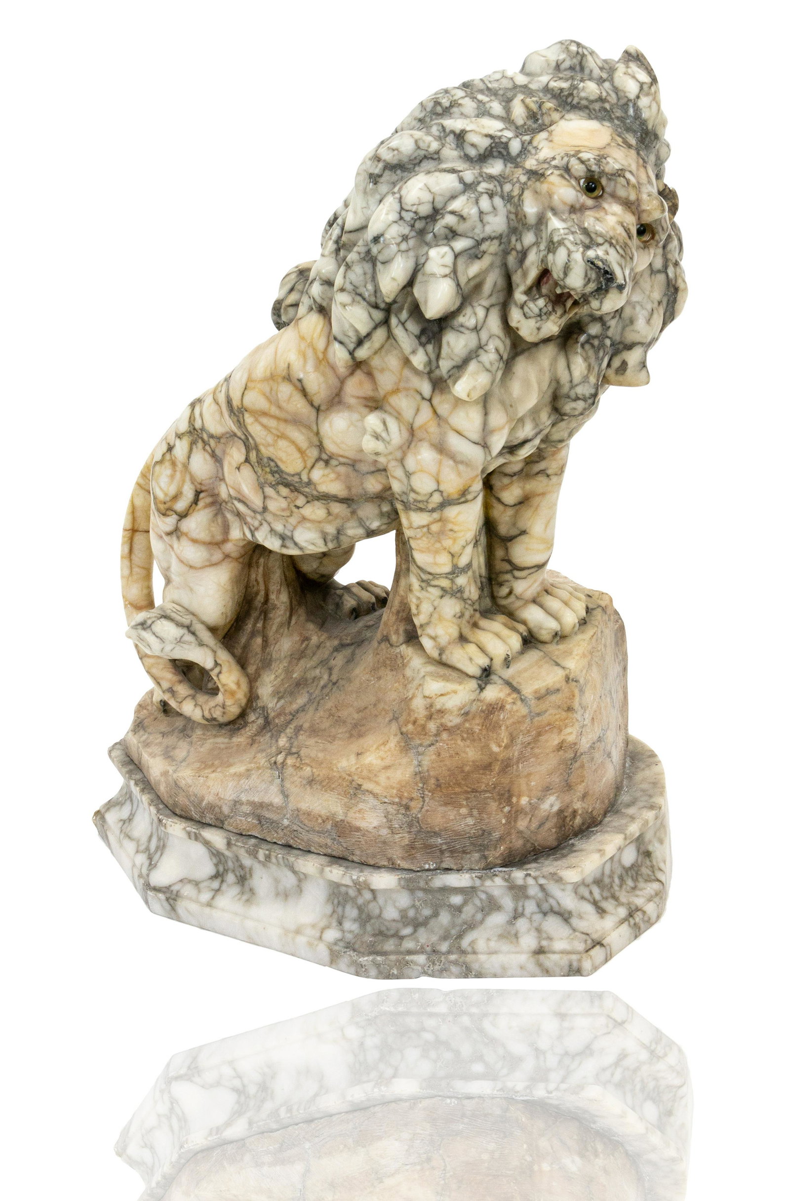 ALABASTER SCULPTURE OF A LION: the roaring lion shown standing on a rock; overall height: 55 cm (21 5/8 in.) CONDITION The sculpture is in very good condition.