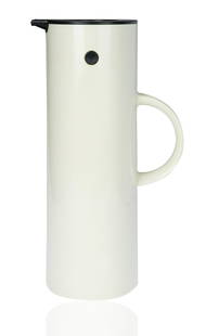 ERIK MAGNUSSEN FOR STELTON JUG, DESIGNED 1977: slim design, with tilting lid and conforming handle, egg shell color with black accents, marked with manufacturer's mark, designer name and MADE IN DENMARK underside of jug; height: 30 cm (11 3/4 in.)