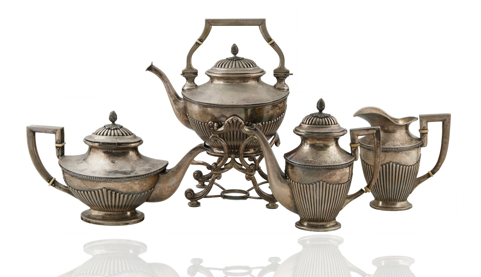 AN ANTIQUE FOUR PIECE SILVER SERVICE SET (1 of 4)