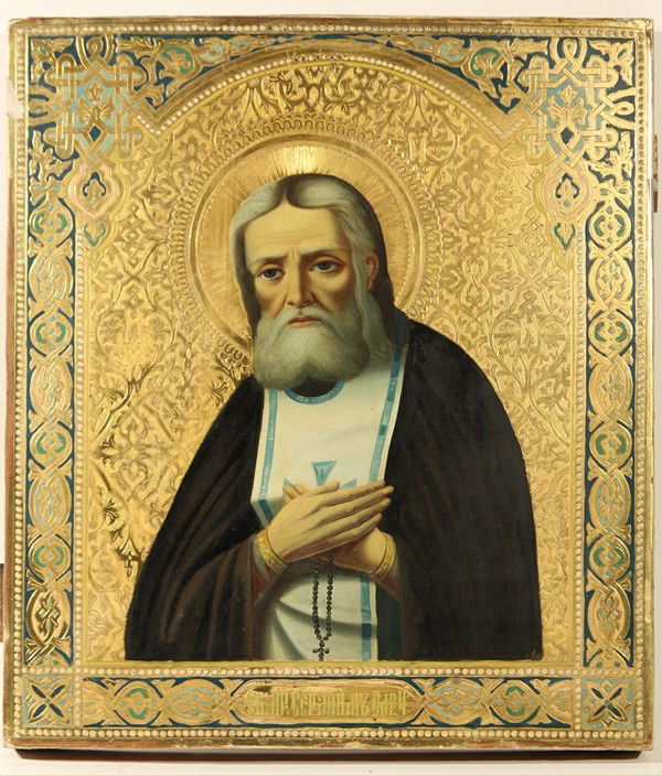 ANTIQUE RUSSIAN ICON SAINT SERAPHIM OF SAROV: RUSSIAN ICON, SAINT SERAPHIM OF SAROV, CIRCA 1900. Egg tempera, gold leaf, and gesso on wood. 35.5 x 31 cm (14 x 12 1/4 in.). Two insert splints on the back. Old stamp on the verso from the Barakov Ic