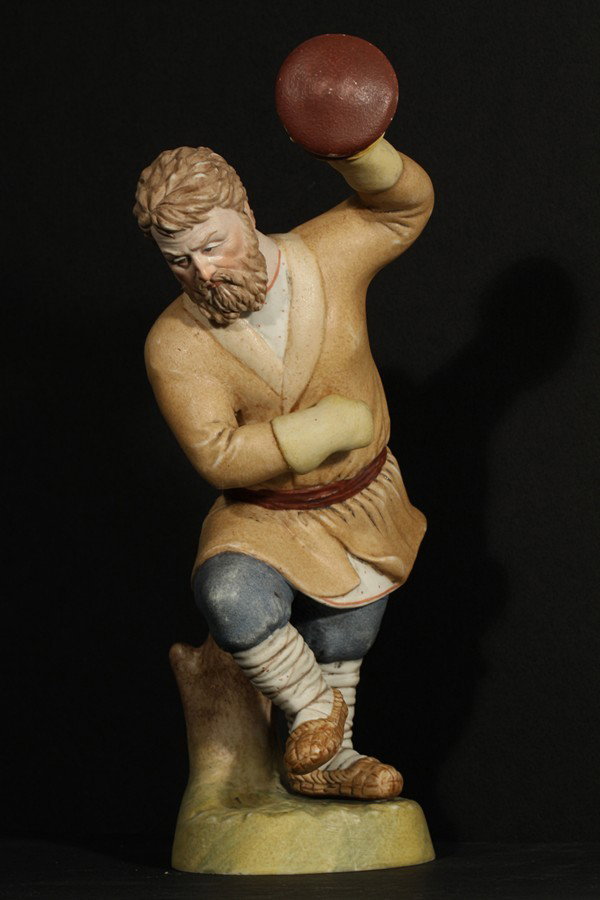 RUSSIAN GARDNER PORCELAIN FIGURE: GARDNER PORCELAIN FIGURE OF A MAN DANCING, Gardner Porcelain Factory, Moscow, figure of a peasant man dancing with his hat in his hand, height: 20.5 cm. (8 in.), impressed and red overglazed Gardner f
