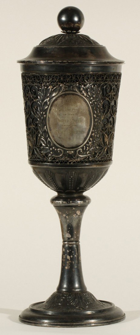 RUSSIAN SILVER CHALICE TROPHY: A SOVIET SILVER PRESENTATION TROPHY CHALICE, C.1940s-1950s, with elaborate filigree work, height: 35.5 cm (14 in.), engraved on the center in Latin characters, 'To the Amatuer Athletic Union of the Un