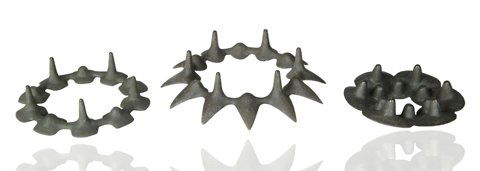 GROUP OF THREE MID-CENTURY IRON DANSK CANDLE-HOLDERS (1 of 4)