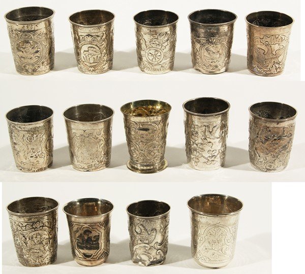 GROUP OF 14 ANTIQUE RUSSIAN 18THC SILVER TUMBLERS: A GROUP OF THIRTEEN RUSSIAN SILVER TUMBLERS FROM THE 18TH CENTURY AND ONE 19THC, a group of fourteen russian silver beakers featuring wild animals and birds, real and mythical, set amid scrolling vege