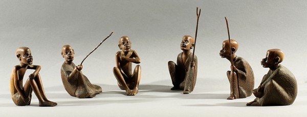 SIX CARVED ROSEWOOD FIGURES DAVID MASAU MULI: DAVID MASAU MULI (AFRICAN B1962), Six carved rosewood figures of African tribesmen, some holding sticks or bowls, height: each about 10 cm. (4 in.), all but one signed 'D. Muli' on base THIS LOT IS BE