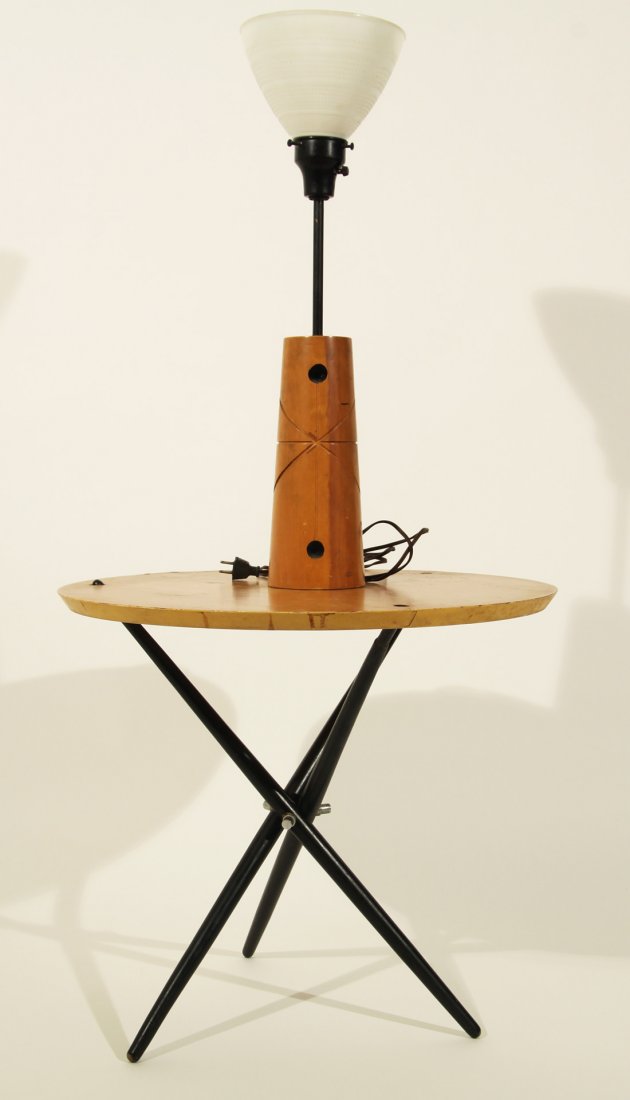A HANS BELLMAN TRIPOD TABLE AND MATCHING LAMP FOR: A HANS BELLMAN TRIPOD TABLE AND MATCHING LAMP FOR KNOLL, 1950S, the three folding legs joined with aluminum knobs, the legs piercing the round table top, the matching lamp with glass shade, table diam