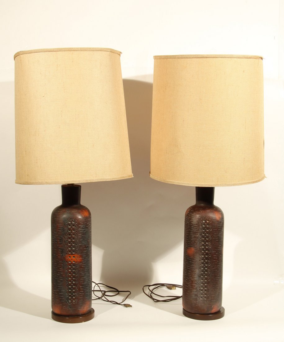 A PAIR OF LARGE LAMPS WITH ORIGINAL SHADES, possib: A PAIR OF LARGE LAMPS WITH ORIGINAL SHADES, possibly Martz studio, the faux-pottery body decorated with geometric motifs, height without lamp shades: 85 cm. (33 ½ in.), height with lampshades: 96 cm.