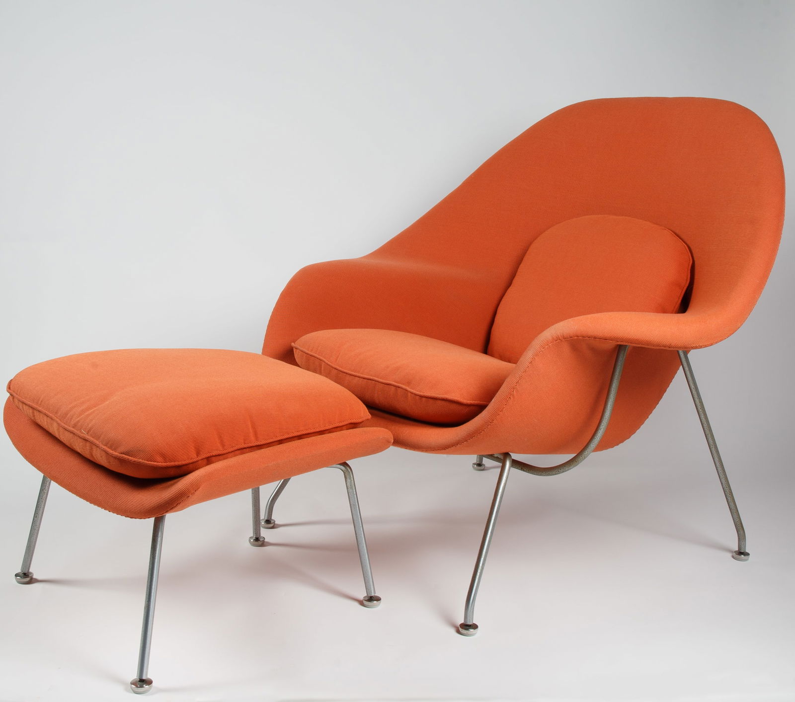 'WOMB' CHAIR AND OTTOMAN BY EERO SAARINEN (FINNISH-AMERICAN 1910-1961) FOR KNOLL: 'WOMB' CHAIR AND OTTOMAN BY EERO SAARINEN (FINNISH-AMERICAN 1910-1961) FOR KNOLL first designed in 1946, ground-breaking in its comfort chair designed exclusively for Knoll, polished stainless steel a