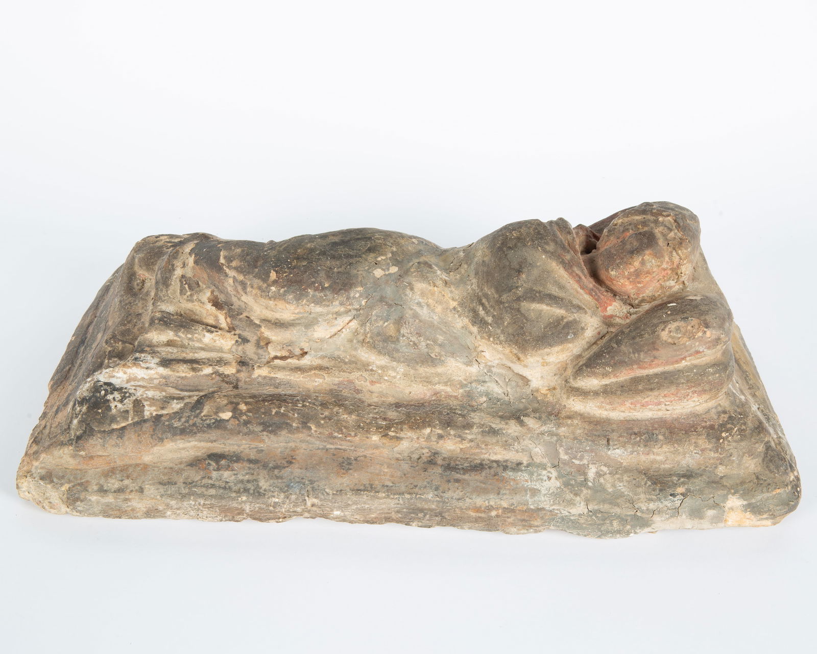 CARVED STONE CINERARY LID WITH RECLINING FEMALE FIGURE, POSSIBLY ETRUSCAN ART, CIRCA IV CENTURY B.C.: CARVED STONE CINERARY LID WITH RECLINING FEMALE FIGURE, POSSIBLY ETRUSCAN ART, CIRCA IV CENTURY B.C. dimensions: 14 x 49 x 25 cm (5 1/2 x 19 1/4 x 9 7/8 in.)