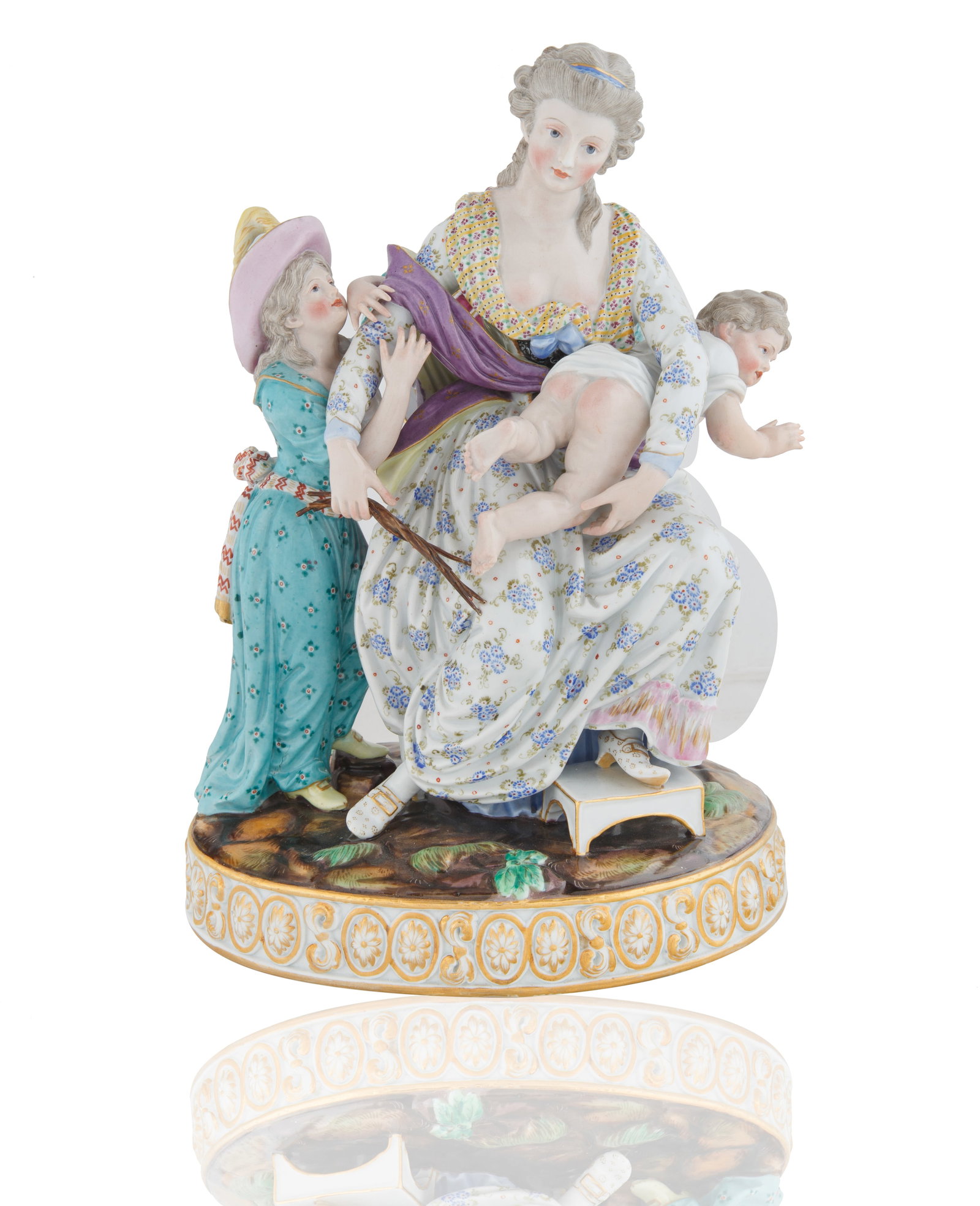 A MEISSEN PORCELAIN 'LOVE PUNISHED' FIGURAL GROUP: A MEISSEN PORCELAIN 'LOVE PUNISHED' FIGURAL GROUP on a oval moulded base with gilt-edging and naturalistic detailing, the mother seated, standing a young girl wrapped around the mothers proper right a