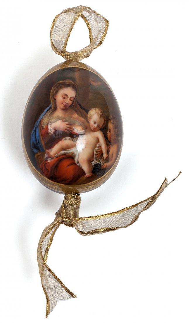 A RUSSIAN PORCELAIN EASTER EGG WITH VIRGIN AND THE CHRI: A RUSSIAN PORCELAIN EASTER EGG WITH VIRGIN AND THE CHRIST CHILD, the cobalt blue body hand-painted with an image of the Virgin with the Christ Child enclosed in a gilt cartouche, 10.5 cm. (4 1/8 in.),