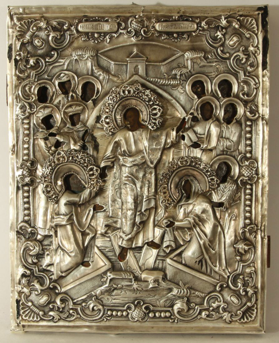 RUSSIAN METAL ICON OF RESURRECTION EARLY 19TH C: A RUSSIAN ICON OF THE RESURRECTION IN A METAL OKLAD, EARLY 19TH C., Egg tempera, gold leaf, and gesso on panel.The silver-colored oklad with ornate chased and repousse scenery and a rocaille scroll bo