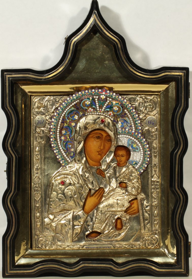 RUSSIAN SILVER ICON TIKHVINSKAYA MOTHER OF GOD C1861: A RUSSIAN ICON OF THE TIKHVINSKAYA MOTHER OF GOD WITH GILT SILVER OKLAD AND INLAID CASE, MOSCOW, 1861, enclosed in a wooden shadow case box with brass inlay, silver gilt oklad decorated with a border 