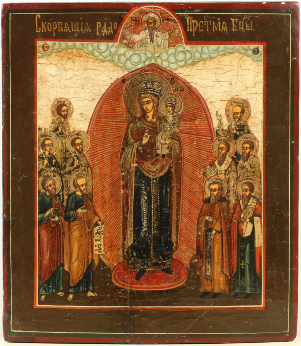 RUSSIAN ICON MOTHER OF GOD JOY TO THOSE WHO SORROW 19TH: A RUSSIAN ICON OF THE MOTHER OF GOD JOY TO THOSE WHO SORROW, 19TH CENTURY, the radiating figure of the Virgin and the Christ Child surrounded by a group of ten saints. Egg tempera, gold leaf, and gess