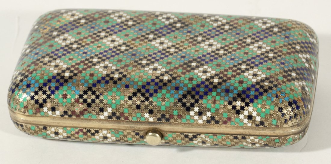 OVCHINNIKOV ANTIQUE RUSSIAN SILVER AND ENAMEL CIGARETTE: A GILT SILVER AND CHAMPLEVE ENAMEL CIGARETTE CASE, OVCHINNIKOV, MOSCOW, C. 1876, of rectangular form with rounded edges, intricately inlaid in a cross stitch pattern with champleve enamel in shades of