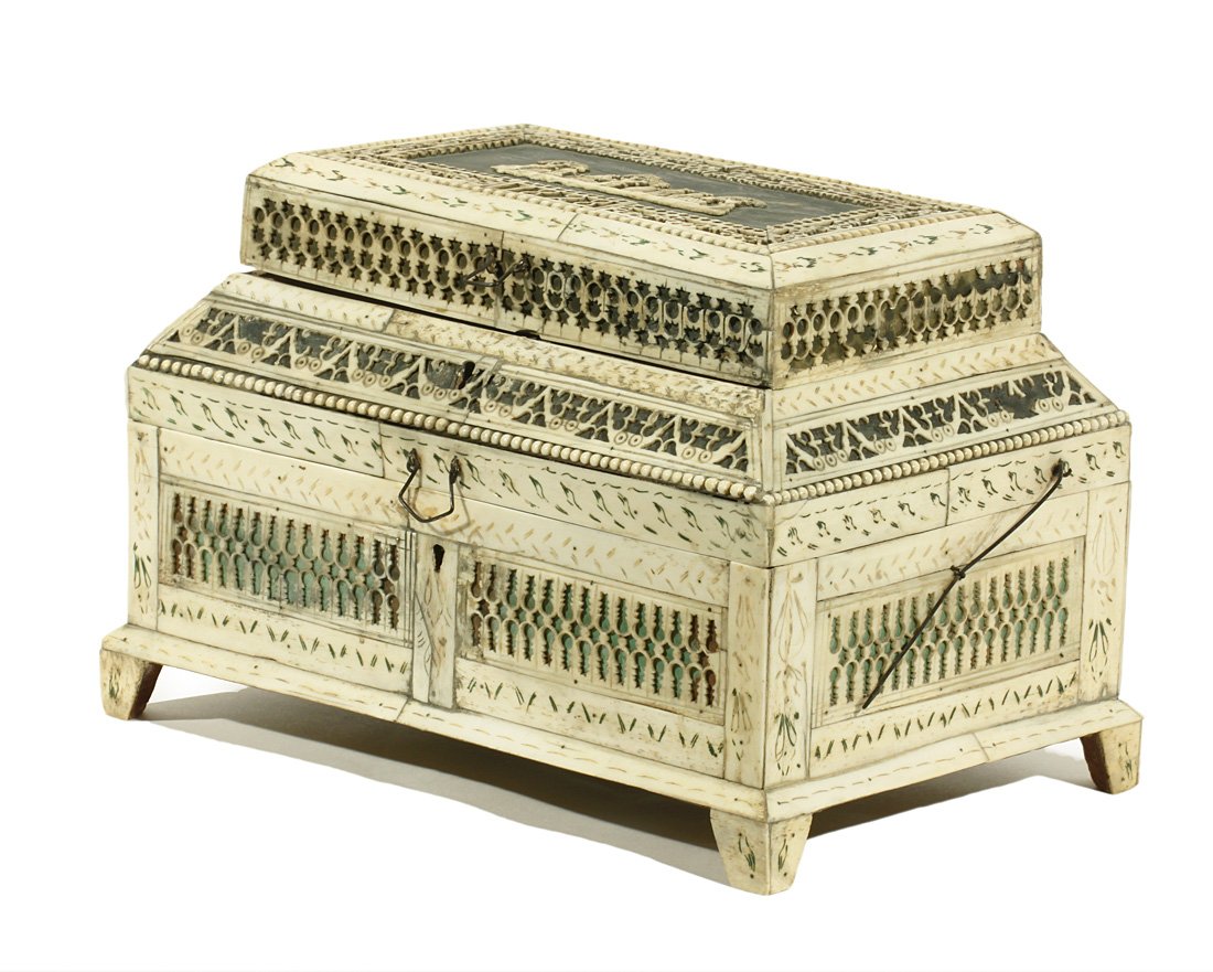 A RUSSIAN WALRUS IVORY AND BONE VENEERED TWO LEVEL: A RUSSIAN WALRUS IVORY AND BONE VENEERED TWO LEVEL CASKET, 1828, Arkhangelsk, of teremok form, the wood base overlaid with panels of pierced ivory engraved with foliate ornament, the top cover with a 