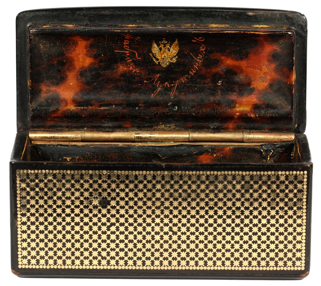 A PAPIER MACHE AND GOLD INLAY BOX, LUKUTIN FACTORY,: A PAPIER MACHE AND GOLD INLAY BOX, LUKUTIN FACTORY, MOSCOW, 1800S, of rectangular shape, with a hinged lid, all exterior panels set with gold paillon stars, simulated tortoiseshell interior, length: 9