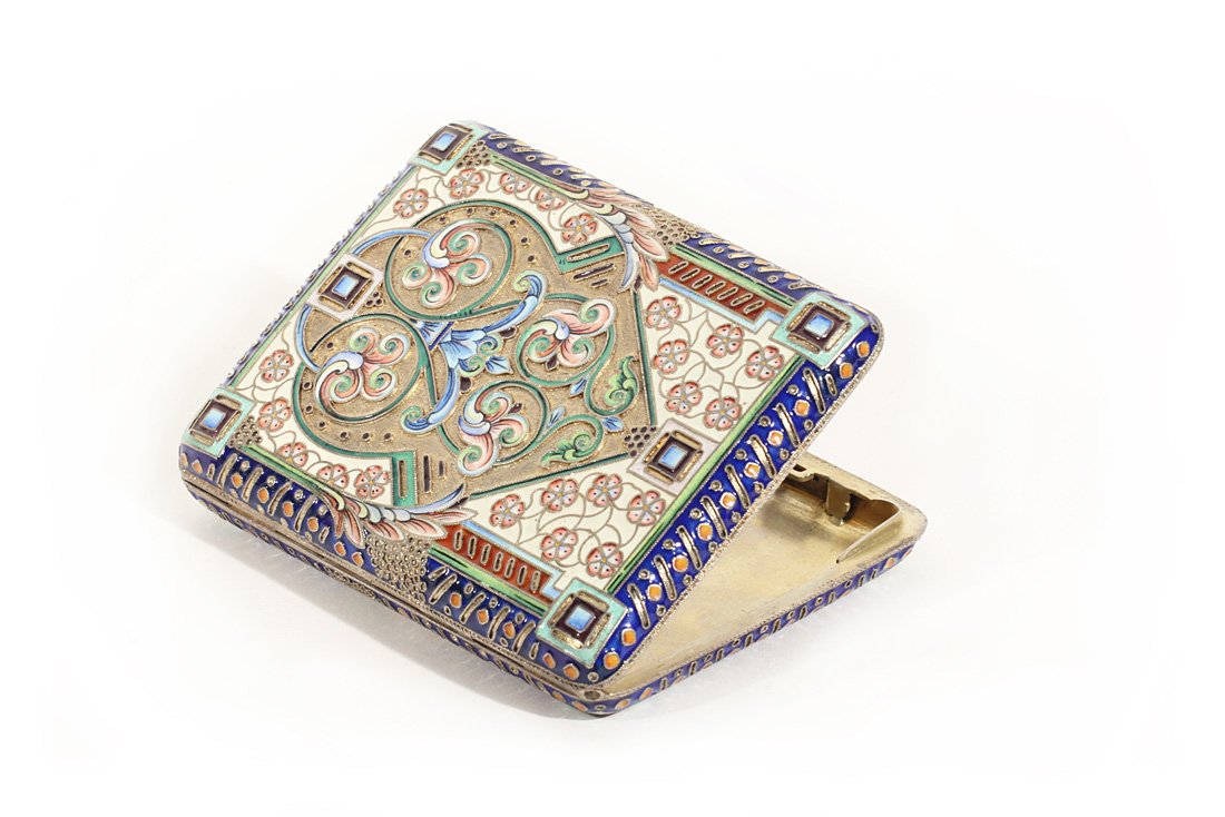 A GILT SILVER AND CLOISONNE ENAMEL CIGARETTE CASE, 11TH: A GILT SILVER AND CLOISONNE ENAMEL CIGARETTE CASE, 11TH ARTEL, MOSCOW, 1908-1926, the exterior panels with interweaving floral designs in shaded enamel on pale yellow ground with scrolling vegetative 