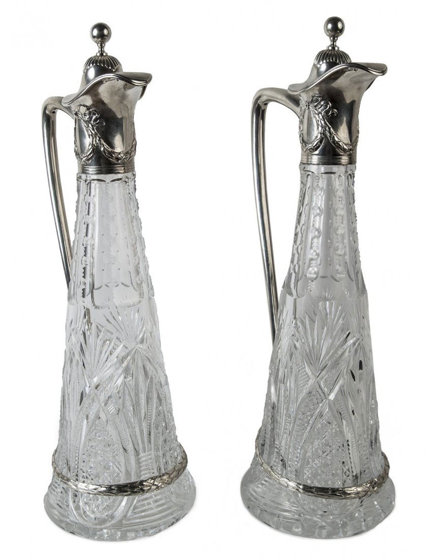 A PAIR OF RUSSIAN SILVER-MOUNTED CUT-GLASS DECANTERS,: A PAIR OF RUSSIAN SILVER-MOUNTED CUT-GLASS DECANTERS, MARKED B. GRACHEV WITH IMPERIAL WARRANT, SAINT PETERSBURG, 1908-1917, of tapering form, the body cut with various geometric patterns, a silver ban