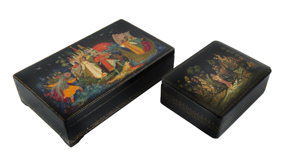 A PAIR OF SOVIET LACQUER KEEPSAKE BOXES WITH SCENES: A PAIR OF SOVIET LACQUER KEEPSAKE BOXES WITH SCENES FROM FAIRYTALES BY ALEXANDER PUSHKIN, M. DYDYKIN AND SMIRNOVA, PALEKH, 1950S, each of a rectangular shape with a hand-painted cover; the hinged cove