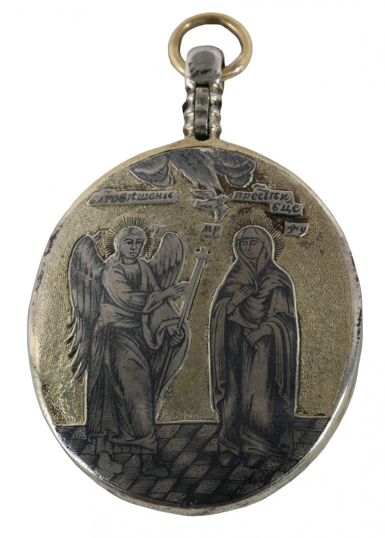 A RUSSIAN SILVER AND NIELLO LOCKET WITH SAINTS, LATE: A RUSSIAN SILVER AND NIELLO LOCKET WITH SAINTS, LATE 18TH-EARLT 19TH CENTURY, the gilt stippled ground with Saint Procopius of Ustyug and Saint John in a landscape on one side and the Annunciation on 