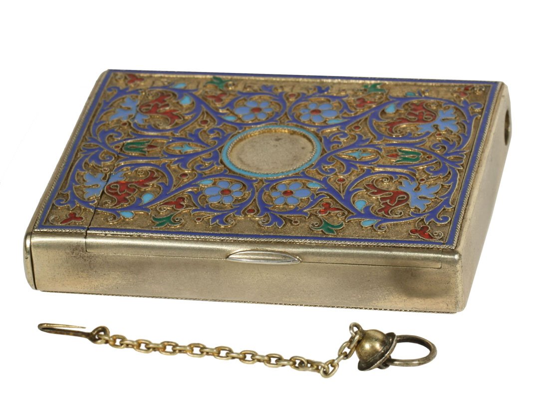 A GILT SILVER AND CLOISONNE ENAMEL VESTA CASE, GRACHEV,: A GILT SILVER AND CLOISONNE ENAMEL VESTA CASE, GRACHEV, ST. PETERSBURG, LAST QUARTER OF THE 19TH CENTURY of rectangular shape, the gilt silver body with scrolling, flowering ivy in shades of blue enam