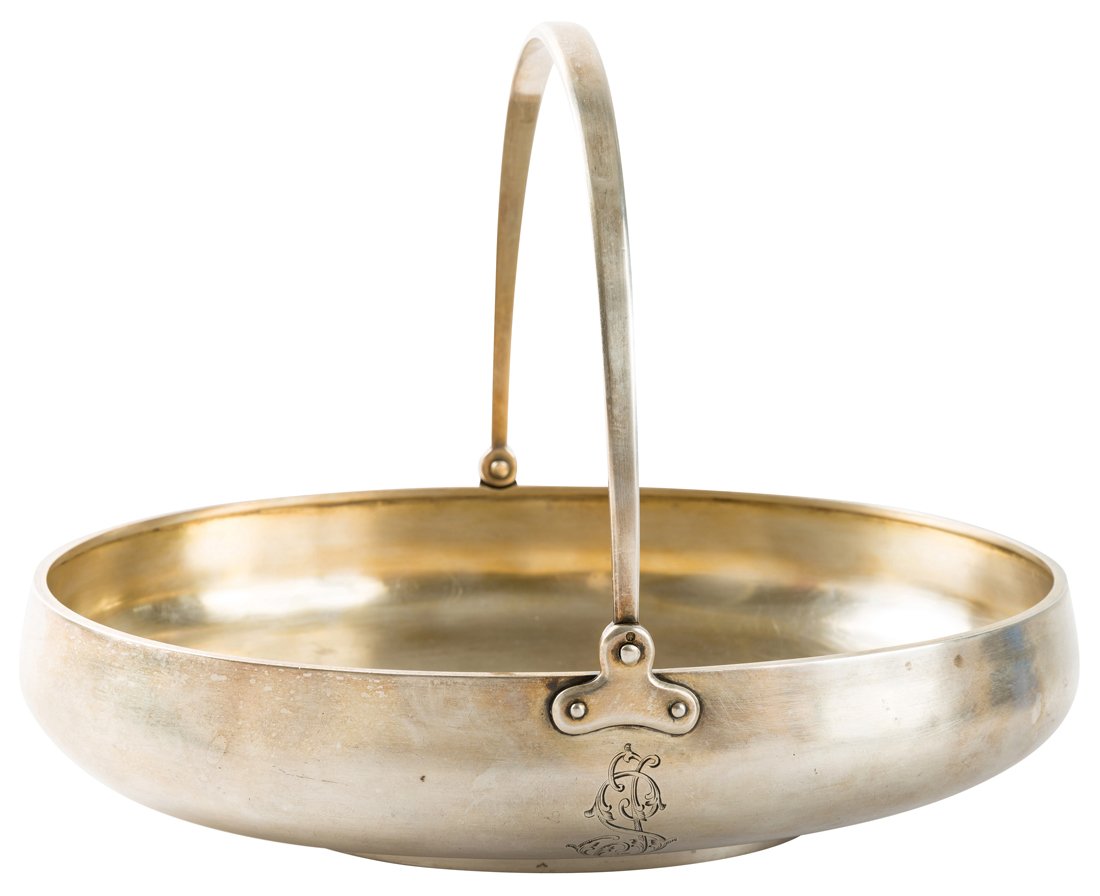 A SILVER CAKE BASKET WITH A SWING HANDLE, GRACHEV: A SILVER CAKE BASKET WITH A SWING HANDLE, GRACHEV BROTHER WITH IMPERIAL WARRANT, ST. PETERSBURG, 1896-1899 of classic shallow oval form, one side with an engraved monogram, gilded interior, length: 22