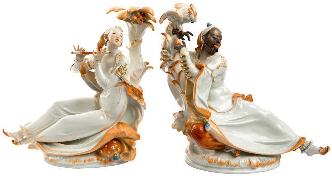 A PAIR OF PORCELAIN FIGURES OF A MOOR WITH PARROT AND (1 of 2)